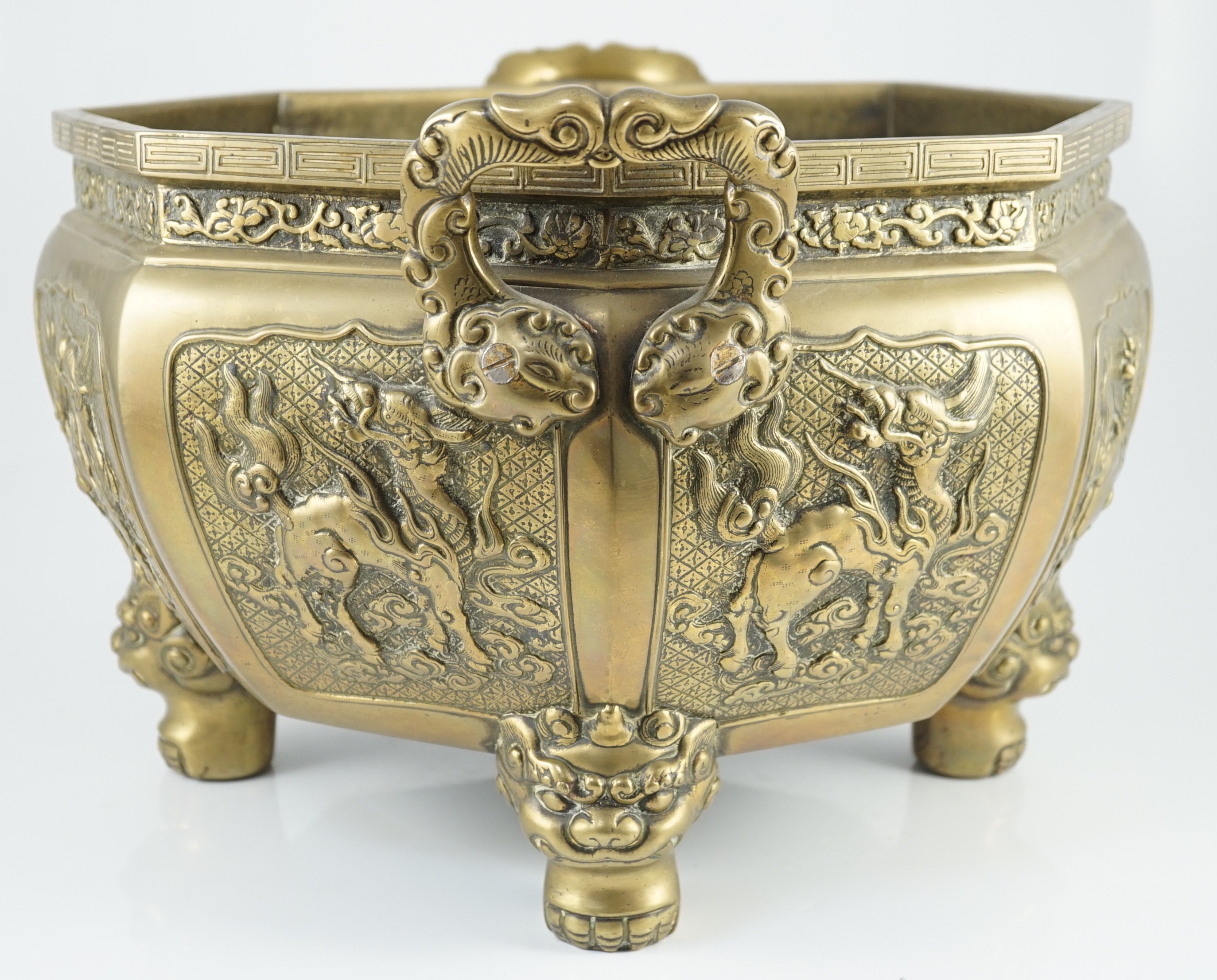 A large Chinese polished bronze octagonal jardiniere, 19th century, 48cm wide at handles, slight faults